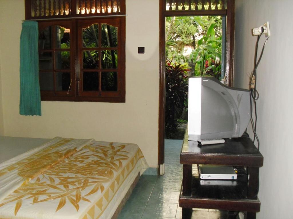 Adus Beach Inn Легиан Номер фото